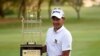 Thailand's Tirawat Kaewsiribandit poses with the winning trophy in Karachi on October 14.