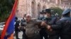  Armenian police officers detain a man near the government building in Yerevan protesting Prime Minister Nikol Pashinian's signing an agreement to end fighting with Azerbaijan over Nagorno-Karabakh , November 10, 2020.