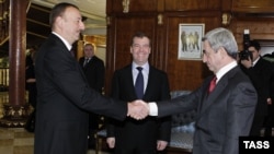 Russia -- President Dmitry Medvedev (C) at a meeting with his Armenian and Azerbaijani counterparts Serzh Sarkisian (R) and Ilham Aliyev in Sochi, 23Jan2012