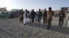 Afghan security forces at the site of a deadly suicide attack on a police station in Logar Province on May 30. 