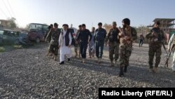 Afghan security forces at the site of a deadly suicide attack on a police station in Logar Province on May 30. 