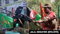 Private security guards secure the venue of a mourning procession ahead of Ashura, in Herat, western Afghanistan, on September 19.