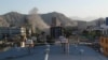 Smoke rises from a building during in the Shahr-e-Naw area in Kabul on May 9.