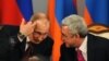 Armenia -- Russian President Vladimir Putin (L) speaks with his Armenian counterpart Serzh Sarkisian during a signing ceremony in Yerevan, December 2, 2013