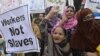 Pakistani NGO activists and working women shout slogans during a rally held to mark International Human Rights Day in Lahore (file photo)