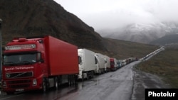 Georgia - Armenian and other heavy trucks are lined up on a road leading to the Georgian-Russian border crossing at Upper Lars, 6May2016.