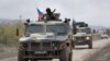NAGORNO-KARABAKH -- Armored vehicles of Russian peacekeepers move along the road towards Agdam from their check point outside Askeran, November 20, 2020.