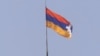 Nagorno-Karabakh -- The unrecognized republic's flag flies over the presidential building in Stepanakert, 18Jun2000