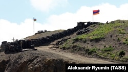 ARMENIA -- Azerbaijani (L) and Armenian army posts on the Armenian-Azerbaijani border, June 18, 2021.