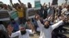 Supporters of a Pakistani religious group chant slogans while blocking a highway in the southern Pakistani city of Karachi on October 31.