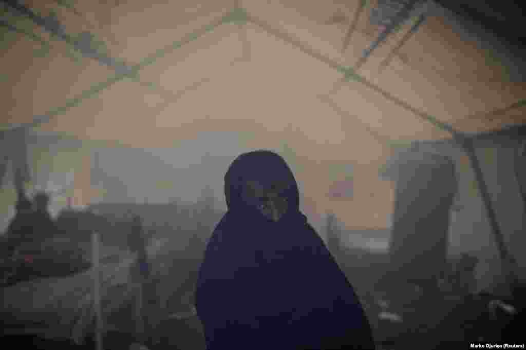 But a UN official has demanded more be done to house the stranded migrants in Bosnia as winter approaches, calling the Vucjak camp “absolutely inappropriate and inadequate for accommodating human beings.” This migrant is seen in a smoke-filled tent, apparently from a fire lit to warm up the flimsy shelter. 