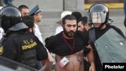 Armenia - Karo Sahakian, a photojournalist for Panarmenian.net, is detained by police in Yerevan, 23Jun2015.