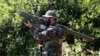 A Hizballah fighter in Lebanon holds an Iranian-made antiaircraft missile on the border with Israel. (file photo)