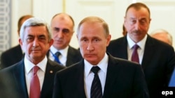 Russia - Russian President Vladimir Putin (front) walks with Azerbaijan's President Ilham Aliyev (R) and Armenian President Serzh Sargsyan (L) during their meeting in St. Petersburg, Russia, 20 June 2016
