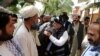 President Ashraf Ghani (center) is greeted during his trip to Ghazni Province on August 17.