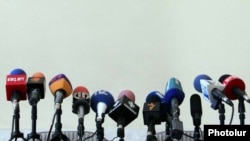 Armenia - TV and radio microphones set for a news conference in Yerevan