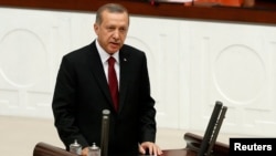 Turkey -- Turkish new President Tayyip Erdogan attends a swearing in ceremony at the parliament in Ankara, August 28, 2014