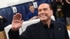 ITALY -- Silvio Berlusconi, leader of right-wing party Forza Italia, waves before to vote at a polling station in Milan, March 4, 2018