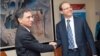 Armenia -- Minister of Economy Tigran Davtian (L) and IFC Caucasus Regional Director Thomas Lubeck sign an agreement in Yerevan, 8Feb2012.