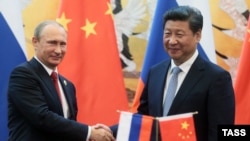 Русия президенты Владимир Путин һәм Кытай башлыгы Си Цзиньпин