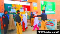 Pakistani voters in the city of Mardan on October 14