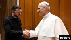 Ukrainian President Volodymyr Zelenskiy meets with Pope Leo XIV on the day of his inaugural Mass in St. Peter's Square at the Vatican on May 18.