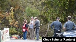 New York State Troopers at the site of a limousine accident that killed 20 people on October 6. 