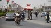 Afghan police guard at a checkpoint in Kandahar Province, site of a deadly attack on October 18.