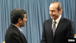 Iran -- President Mahmud Ahmadinejad (L) meets with former Armenian President Robert Kocharian in Tehran, 21Jan2010