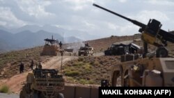 NATO and Afghan commando forces at a checkpoint in Deh Bala district in the eastern province of Nangarhar on July 7 
