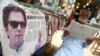 A newspaper bears news of the controversial victory of Imran Khan's Pakistan Tehrik-e Insaf party in the July 25 vote.