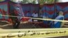 Pakistani officials wait to exhume the grave of Italian national of Pakistani origin Sana Cheema, who was allegedly killed by her family members, in Pakistan's Punjab Province on April 25.