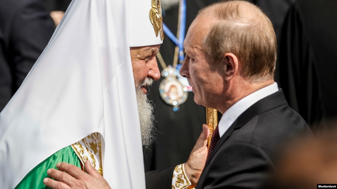 Президент Росії Володимир Путін (праворуч) і патріарх Московський Кирило на відзначенні 1025-річчя Хрещення України-Русі. Київ, 27 липня 2013 року