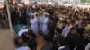 Relatives, residents and government officials offer funeral prayers for slain Pakistani exchange student Sabika Sheikh, who was killed during a school shooting in Texas, following her body's arrival from the United States in Karachi on May 23.