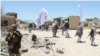 FILE: Taliban fighters in the central province of Ghazni in May 2017. 