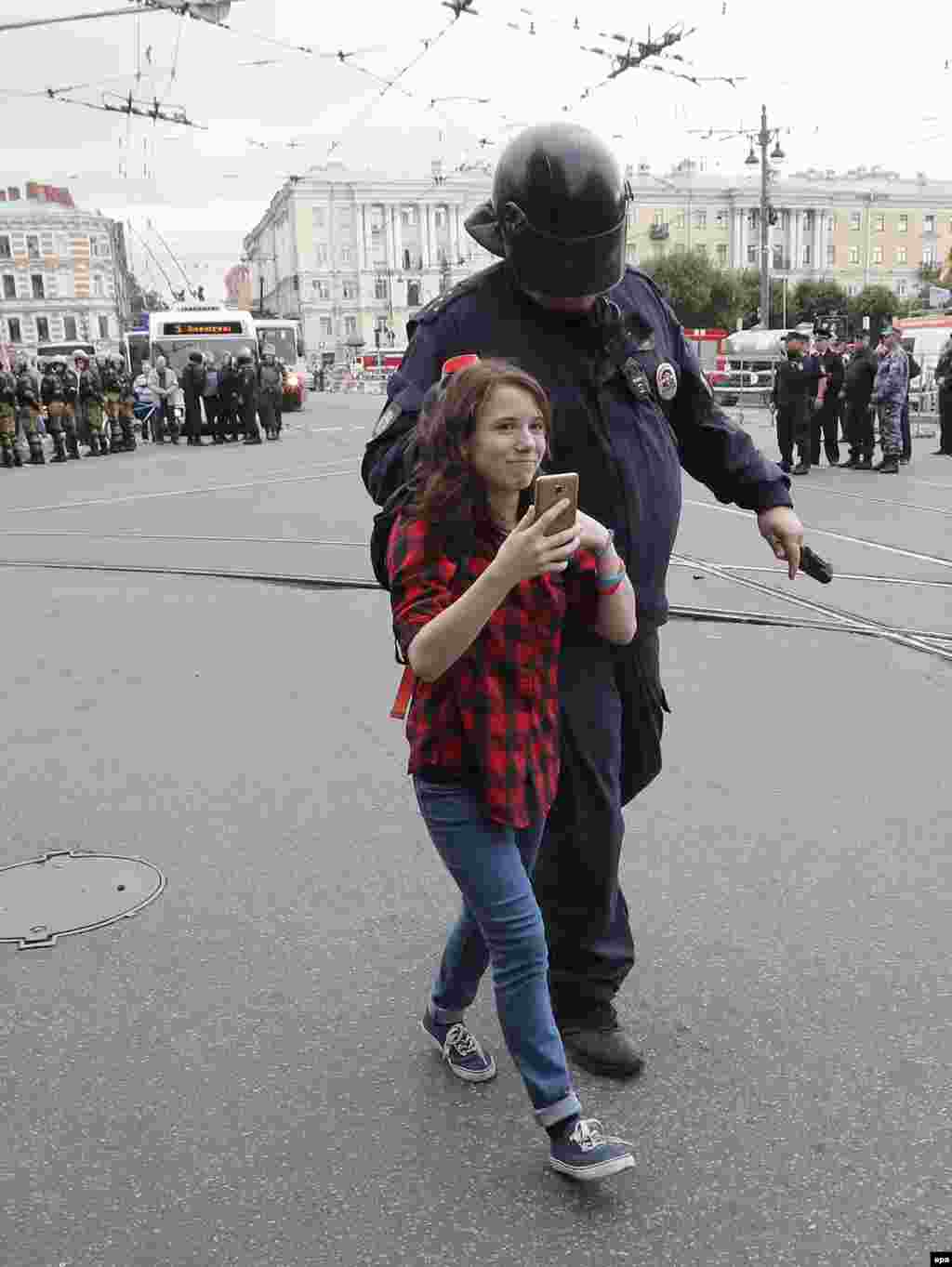 A young protester being detained in St. Petersburg. 