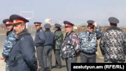 Armenia -- Police monitor traffic on a highway south of Yerevan, 01Mar2011.