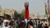 Afghan Shi'a devotees attend a mourning procession commemorating Ashura in Kandahar on September 20.