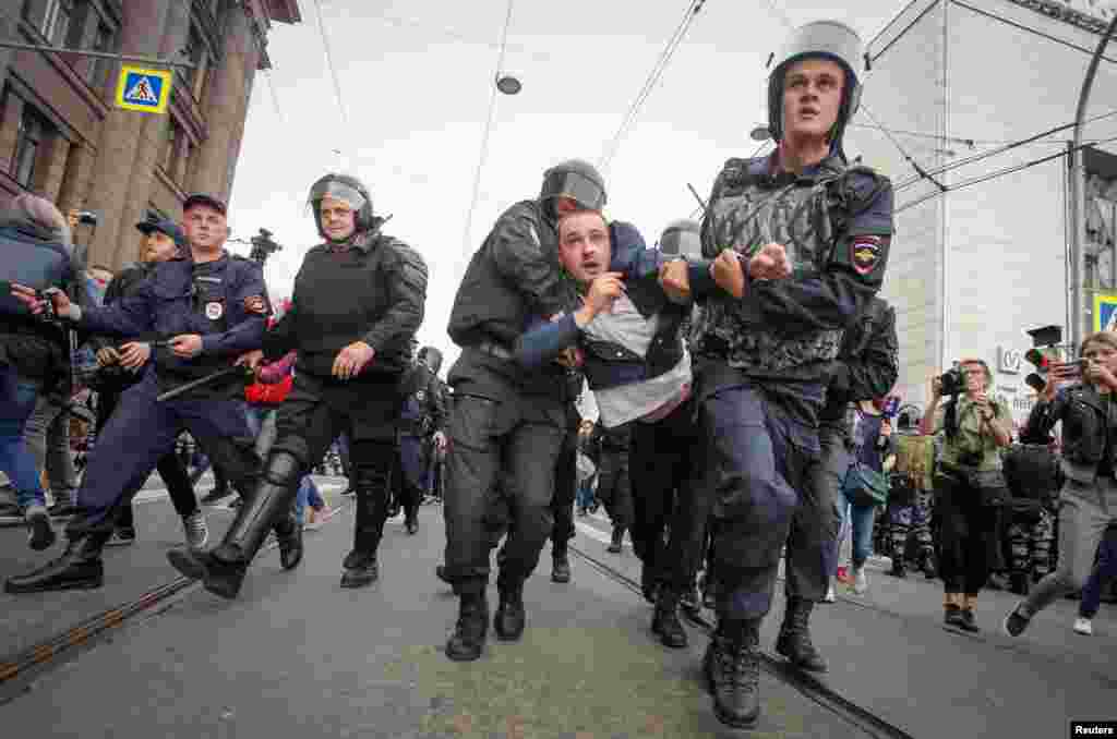 Police charging through protest lines in St. Petersburg. 