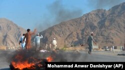 Men shout slogans against terrorists after a suicide attack among the protesters in Momandara district of Nangarhar Province on September 11.