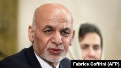 Afghan President Ashraf Ghani delivers a speech next to his wife, Rula Ghani during the United Nations Conference on Afghanistan at the UN Offices in Geneva on November 28.