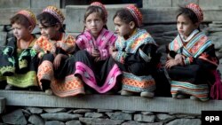 FILE: Kalash girls sitting outside their home in Kalash Valley, Chitral district in northwestern Pakistan's Khyber Pakhtunkhwa Province.