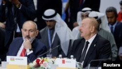 Azerbaijan's President Ilham Aliyev and Armenia's Prime Minister Nikol Pashinyan attend a plenary session in the outreach/BRICS Plus format at the BRICS summit in Kazan, Russia October 24, 2024.
