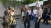 Armenia -- Pavel Manukian (C) and other gunmen standing by an ambulance car at the yard of Erebuni police station in Yerevan seized by them, 17Jul2016.